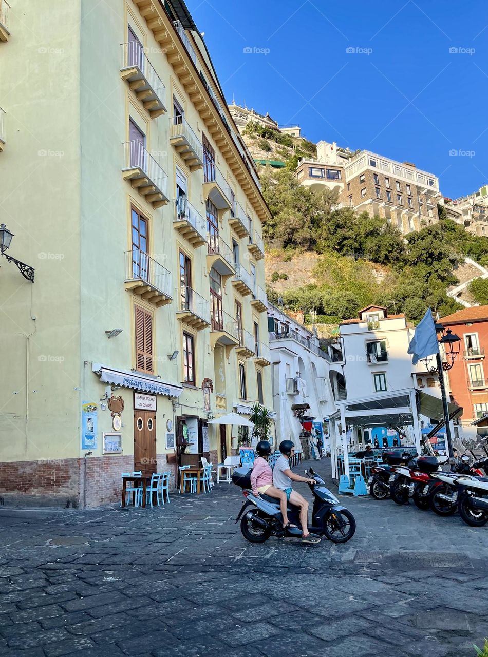 Couple on the scooter in Italy 