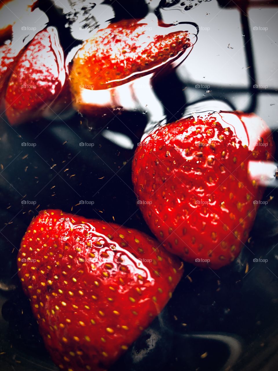 Beautiful red strawberries in water. 🍓