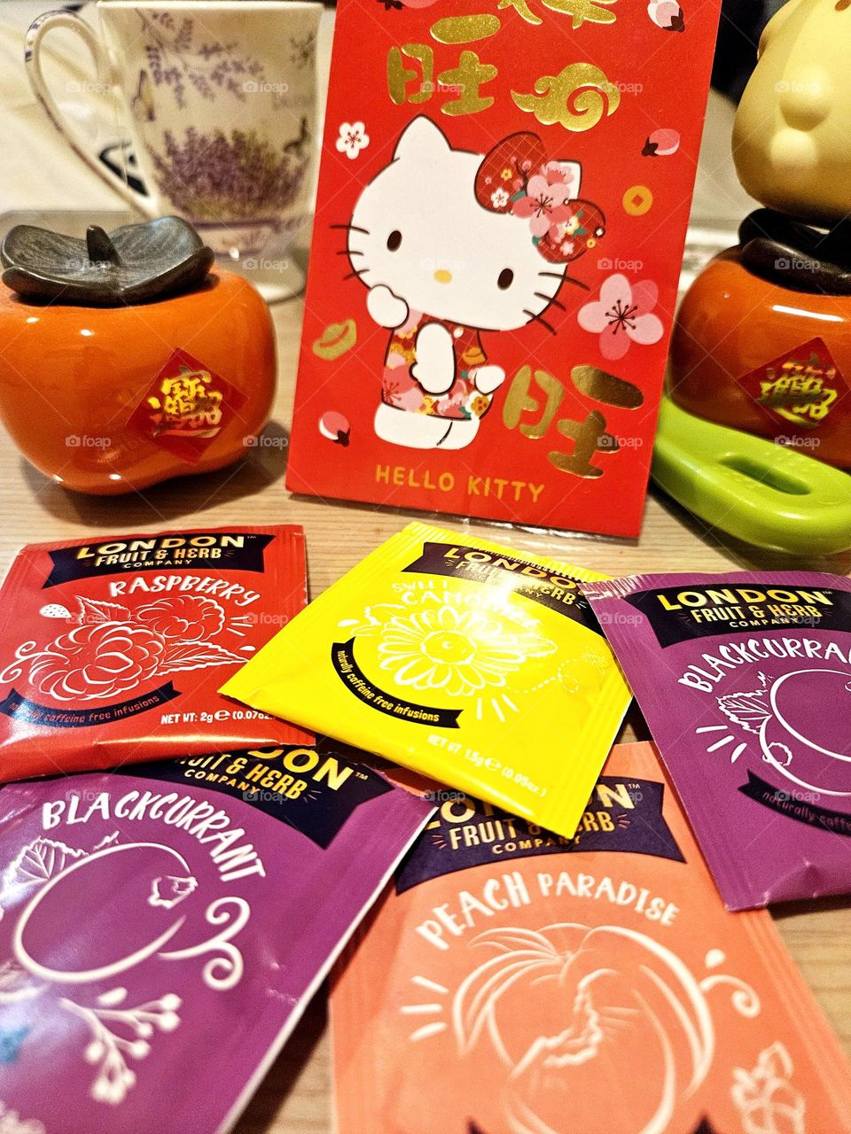 Colorful flower and fruit tea and red envelope persimmon joy