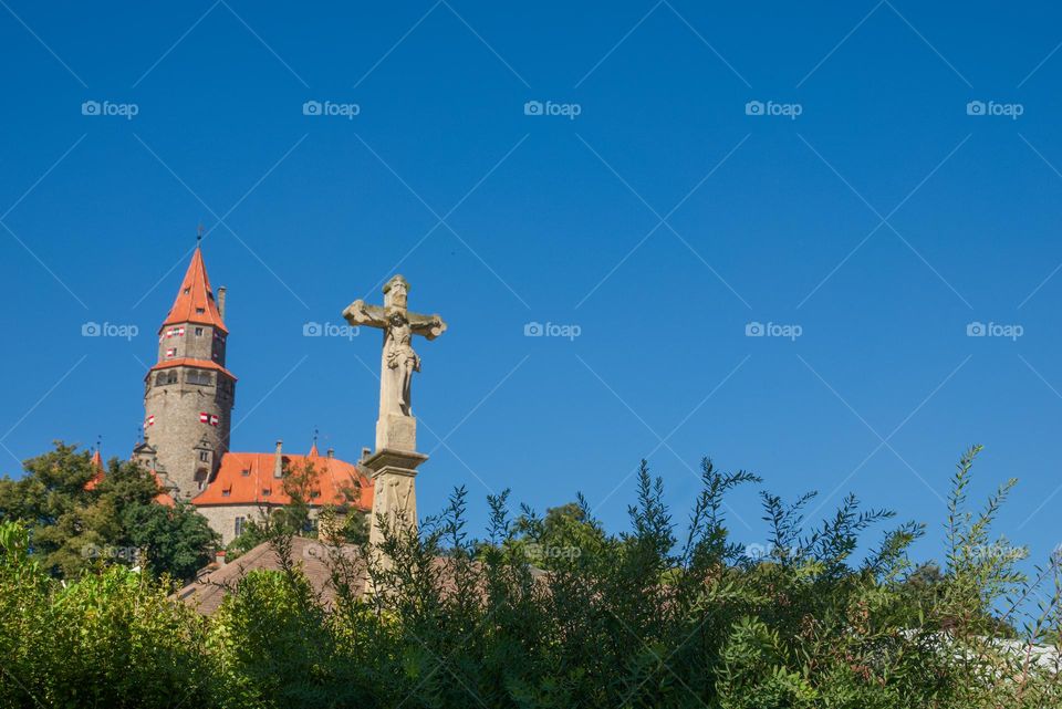 Cross in the background with the famous Czech castle Bouzov.