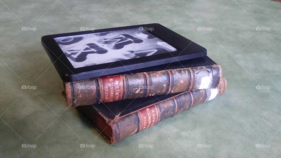 leather bound books with dreaded Kindle