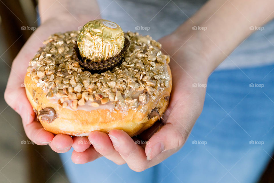 Girl holding donut