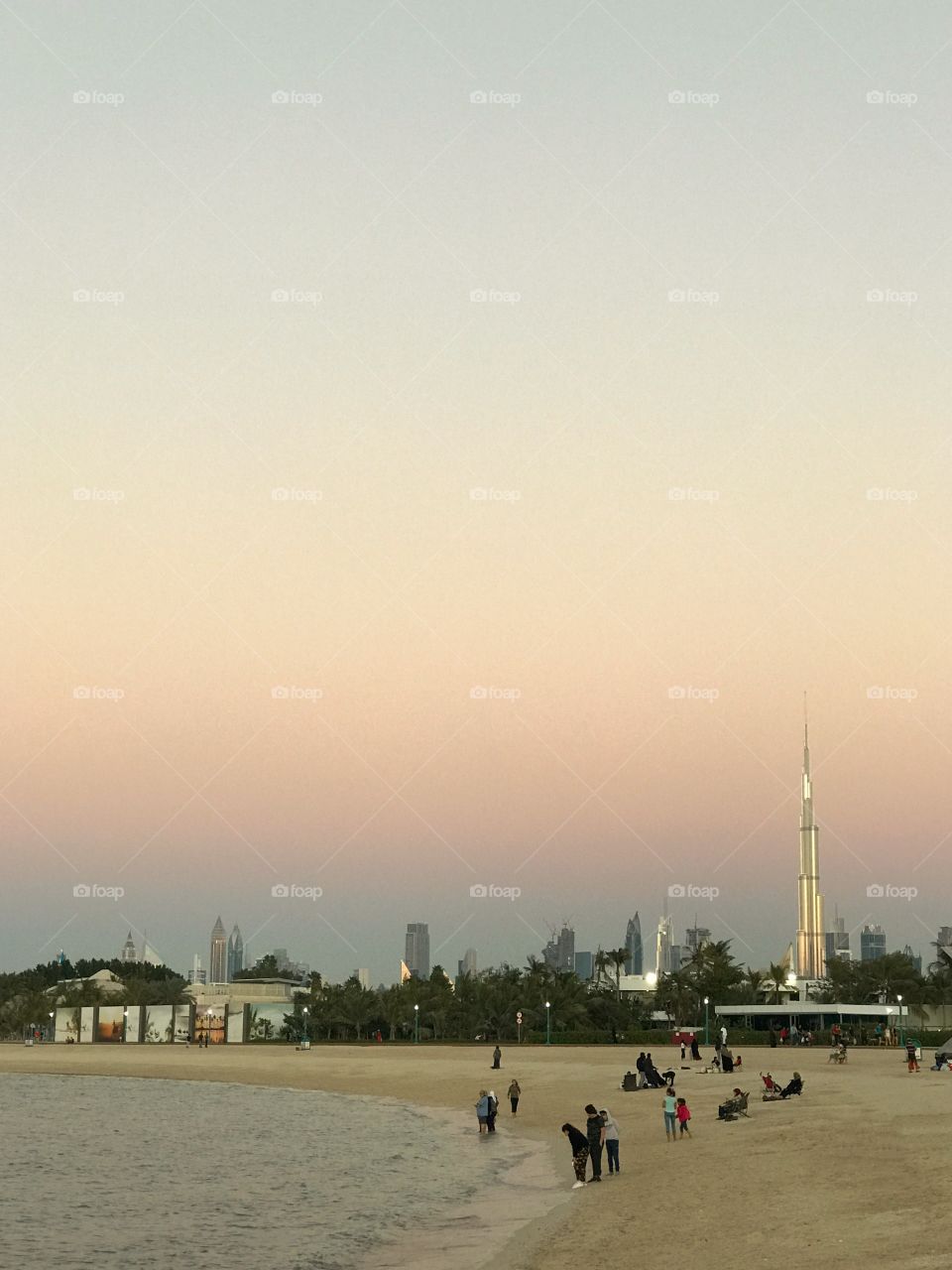 People enjoying the cool evening weather at the Kite Beach in Dubai