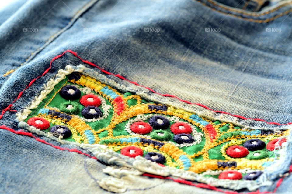 Close-up of decorated jeans