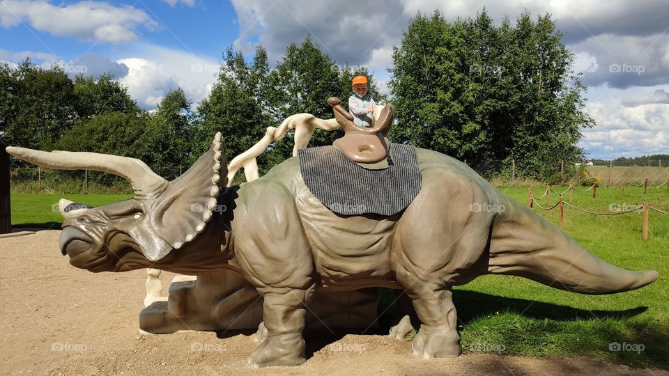 dinosaur triceratop and kid