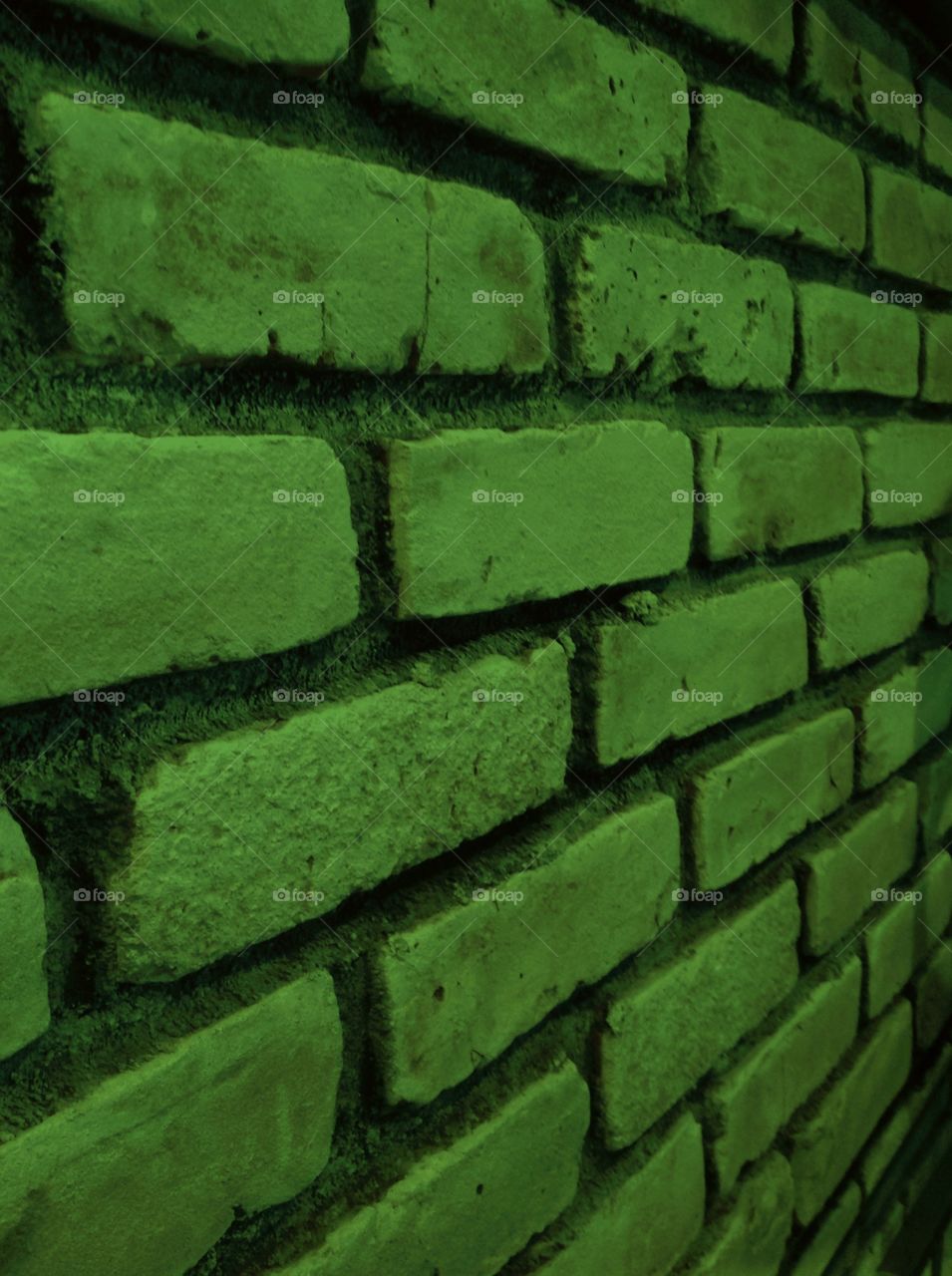 A green brick wall.