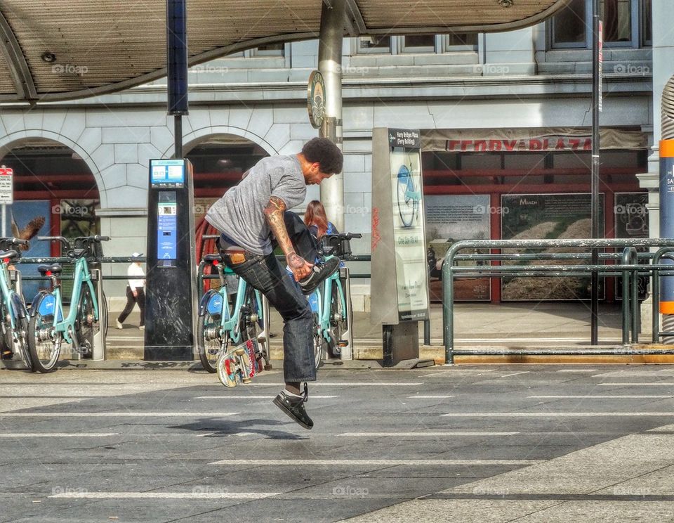 Talented Skateboard Rider Performing A Trick. Skating In The City
