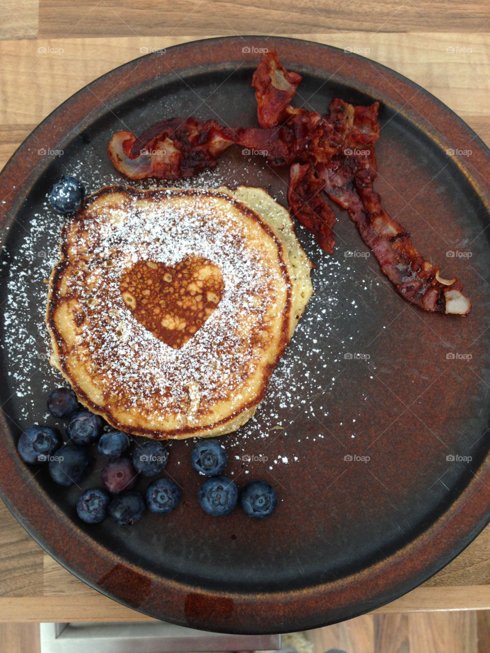 Pancakes with fresh blueberries and honey