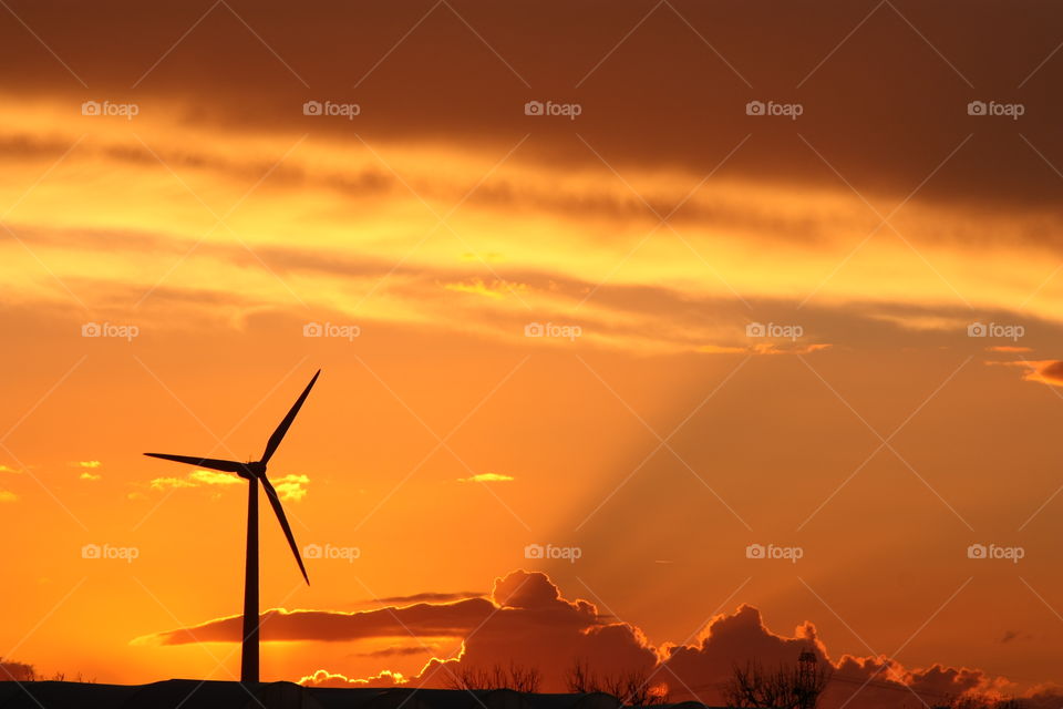 Wind turbine at sunset