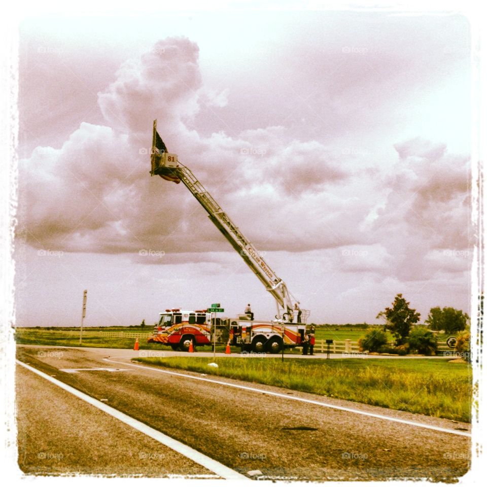Fire Department honoring a fallen hero on an old country highway 