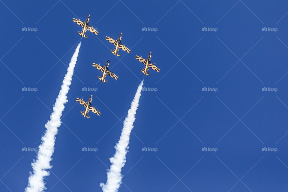 Al Fursan aerobatic team performing their tricks in the sky