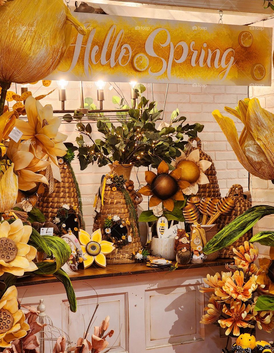 Cute Spring themed decorations create a sunshine and flower laden corner in a retail store