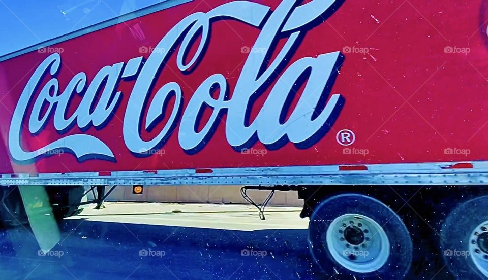 „Coca Cola“ is a trademark known around the World. Since pop art was heralded by „Andy Warhol“ the stylish emblem was elevated to the level of fine art in graphic design. As the Coca Cola truck drove by I had to snap a pic. 2022. Hypnotic Productions