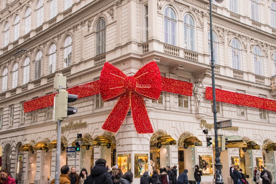 Red Christmas bow on a store building