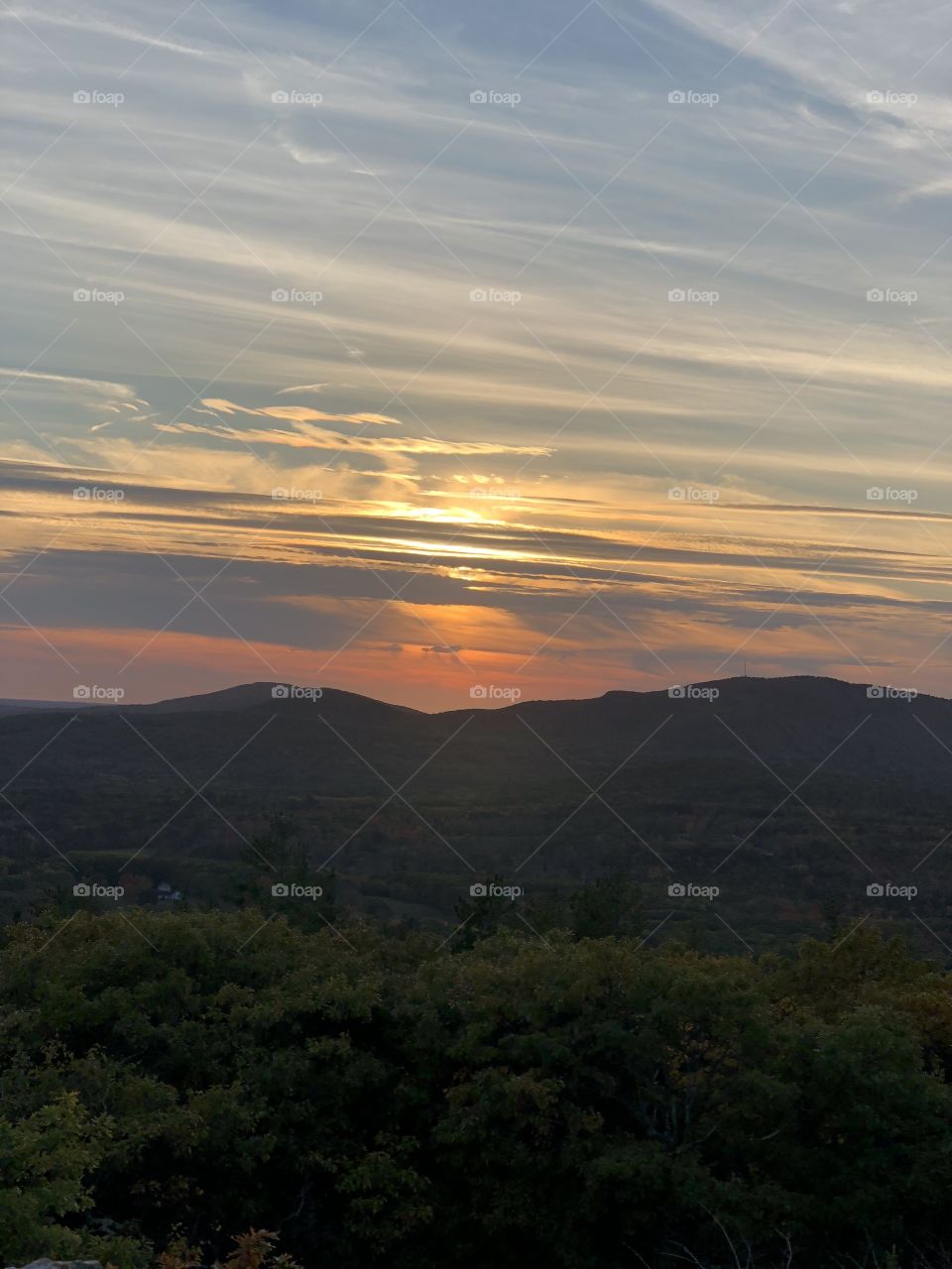 Sunset glow on the horizon on top of Mount Battie in Camden, Maine USA