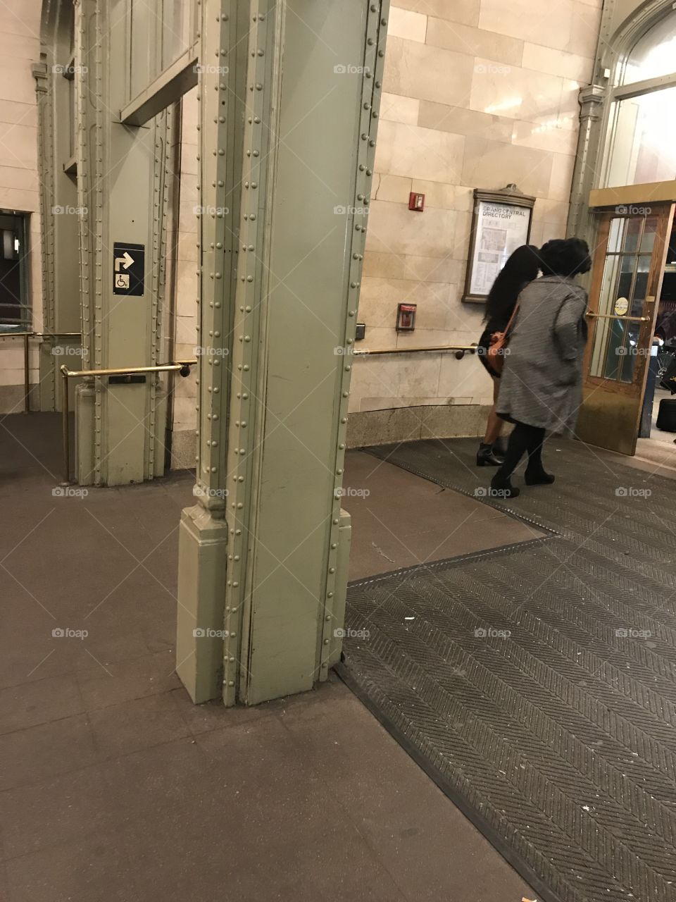 Two ladies exiting Grand Central Terminal, NYC.