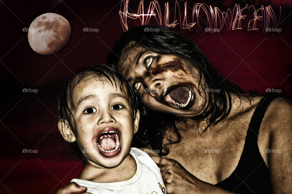 Halloween zombie family. mother and son disguised for the party