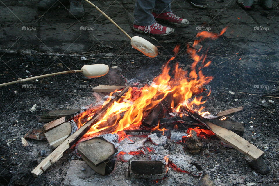 Fresh baking bread above campfire. During a Scouting activity at Scouting Pijnacker, NL
