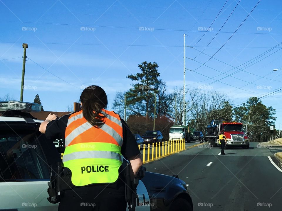 Police clearing a car accident 