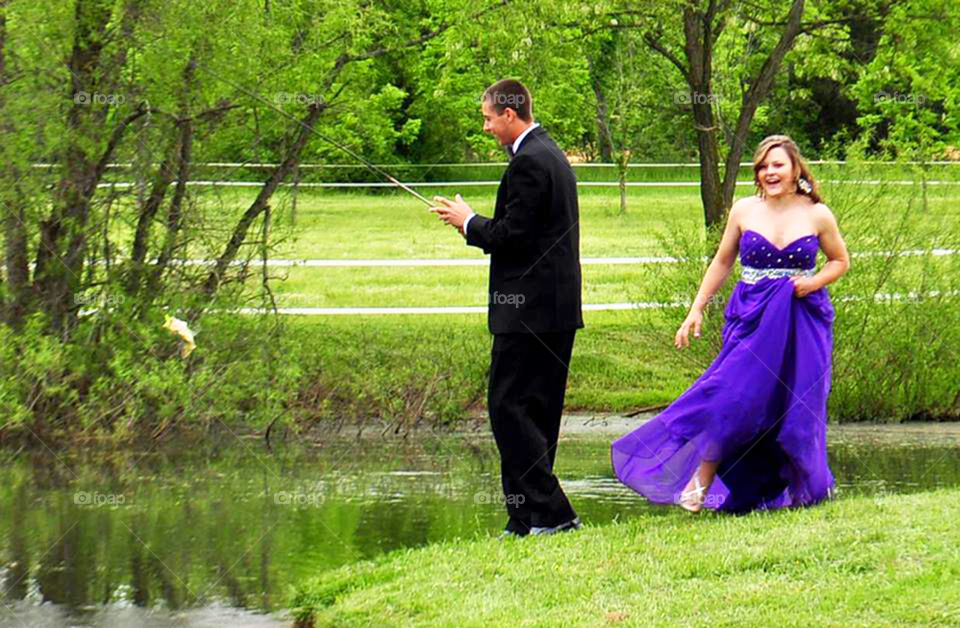 Prom fish. wanted to get a photo of my son in his tux with his fishing rod. However, he actually caught a fish  during the shoot