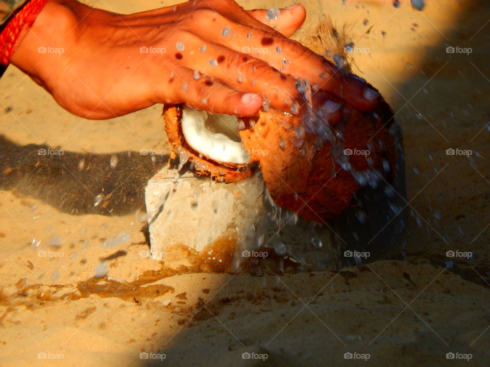 splash of a breaking coconut at split second image capture