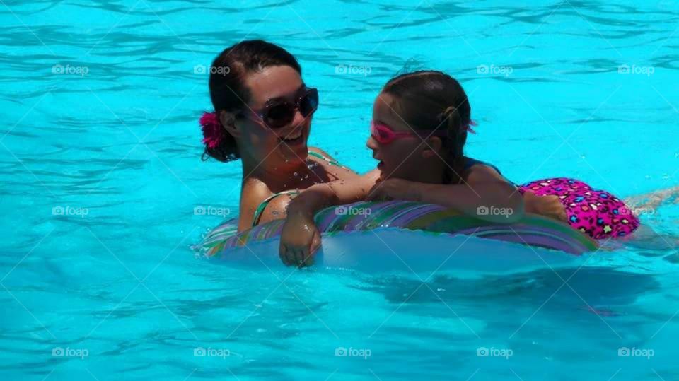 mother and daughter in the pool