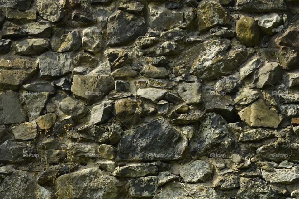 stone wall of Nevitsky castle, Ukraine