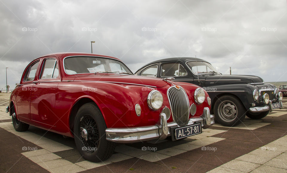 Old classic Jaguars in red and black