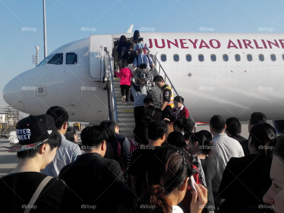 people boarding the plane