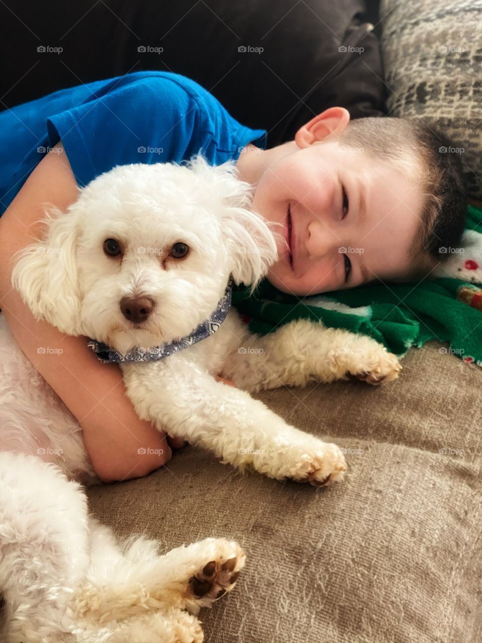 Just a boy and his dog. They both enjoy cuddles!