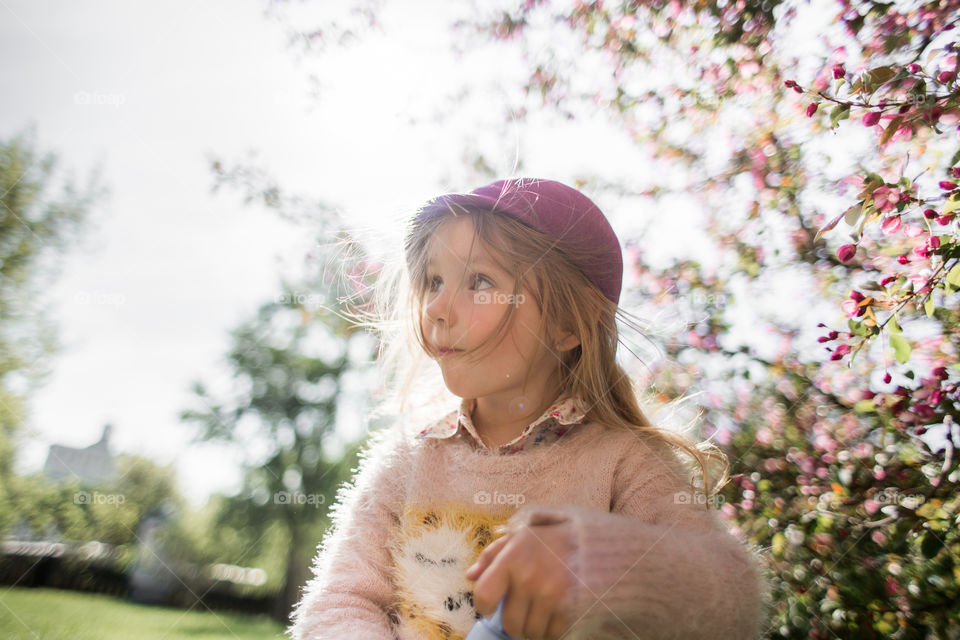 Cute Little girl in a blossom park