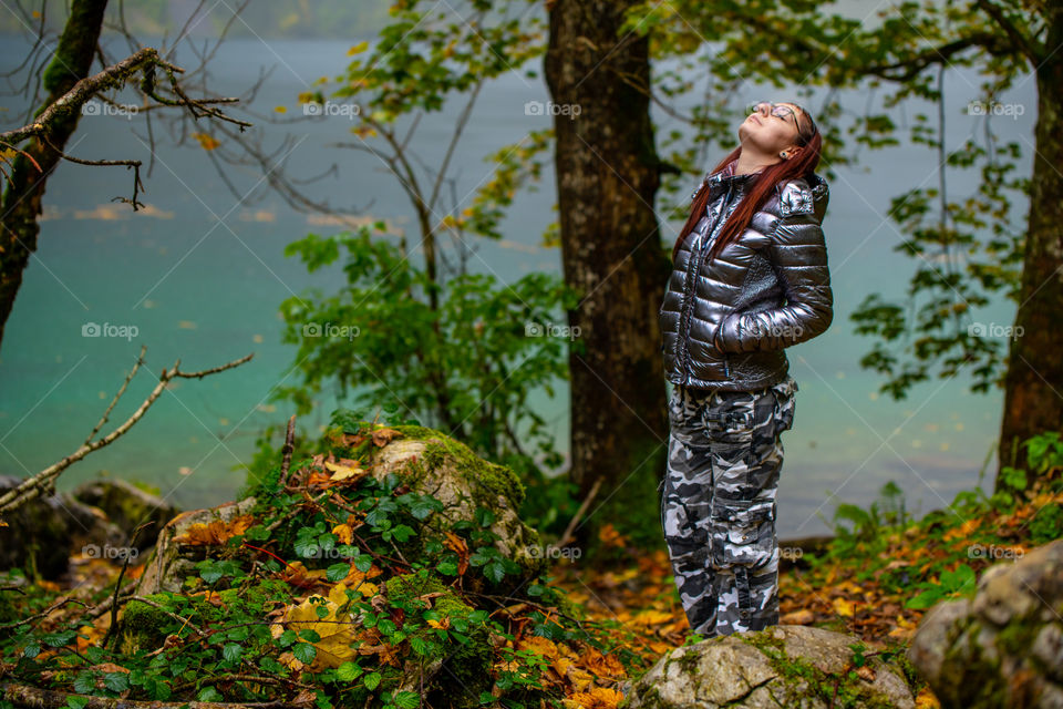 staying in the rain in autumn by Alpen lake, feeling free