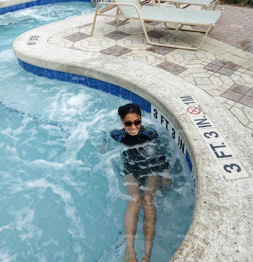 A woman in the jacuzzi pool