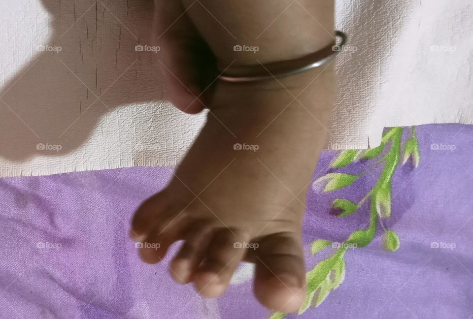 This beautiful β€οΈπ legs of two months baby girl π₯π. Baby is sleeping in her bed and playing joyfully with her toys!!πͺπ§Έ