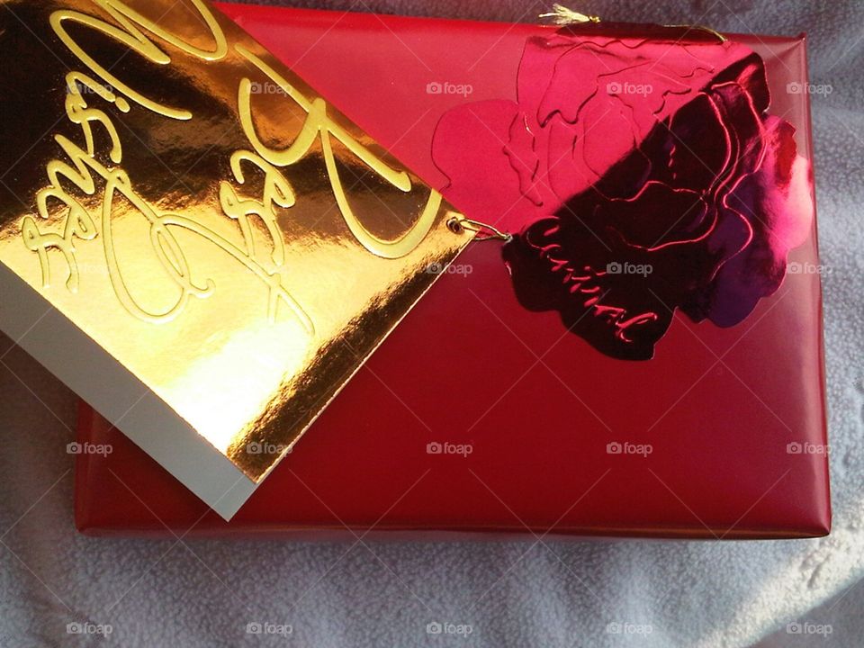 Red box gift with gold card.
