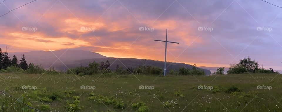 Sunset clouds with a cross