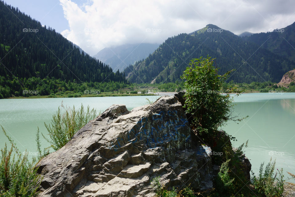 Big Almaty Lake at the Ile-Alatau National Park near Almaty, Kazakhstan on summer afternoon.