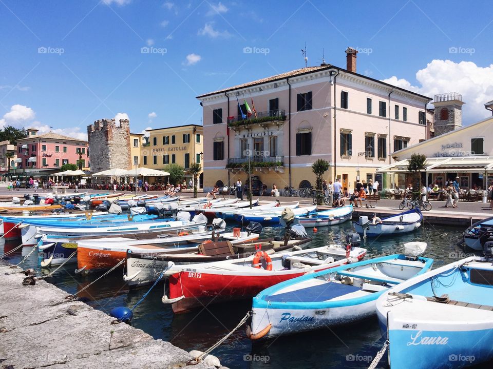 Small port and olt town on a sunny day in Bardolino, Lake Garda, Italy