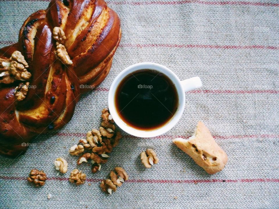 Close up of hot tea and baguette