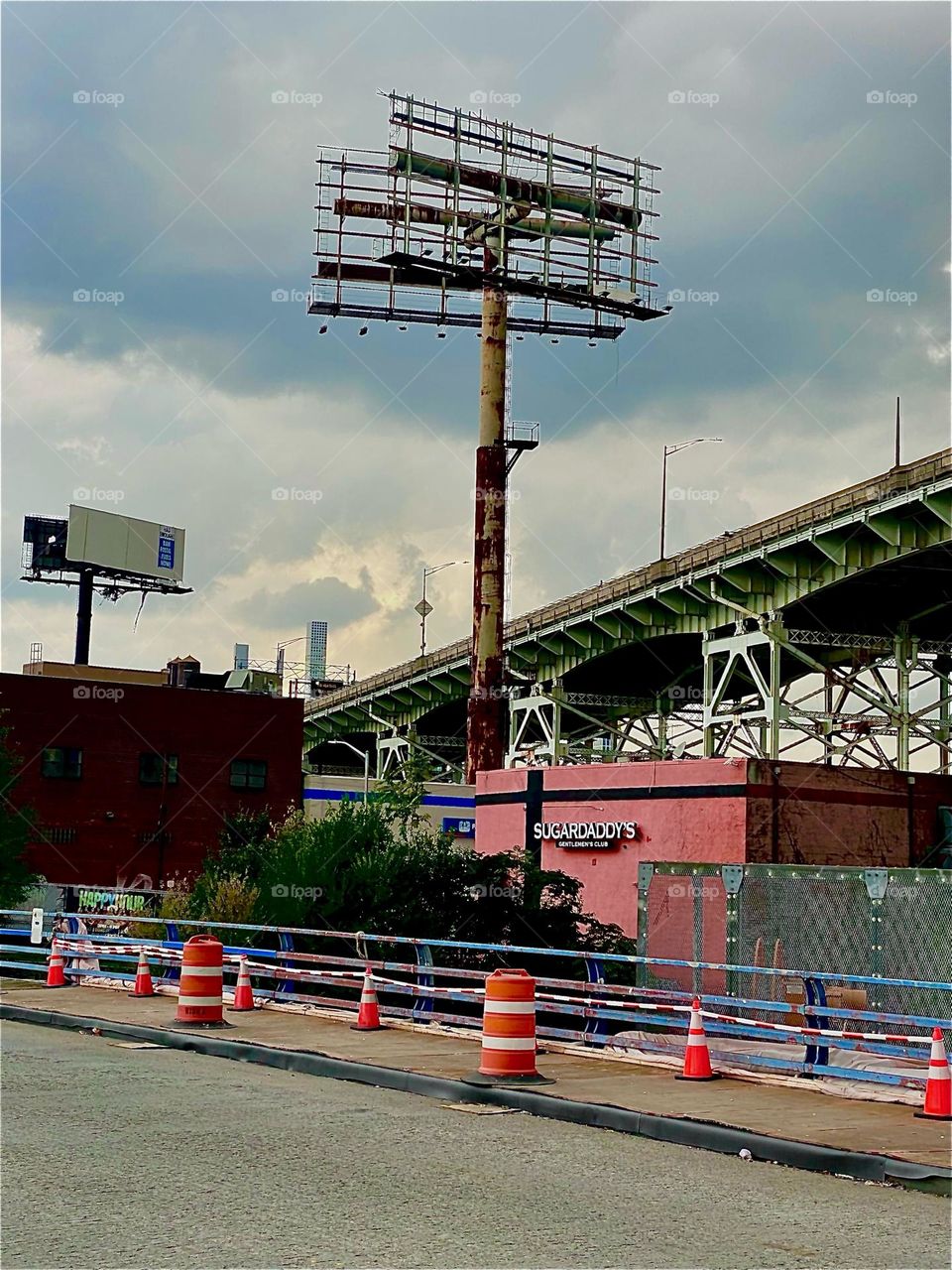 This is a view of the downward slope the “Brooklyn Queens Expressway” or “BQE” is taking as it runs parallel to the “Borden Ave Bridge” over “Dutch Kills” towards the “Pulaski Bridge” at “Newtown Creek” in LIC, Queens. 2023. Hypnotic Productions