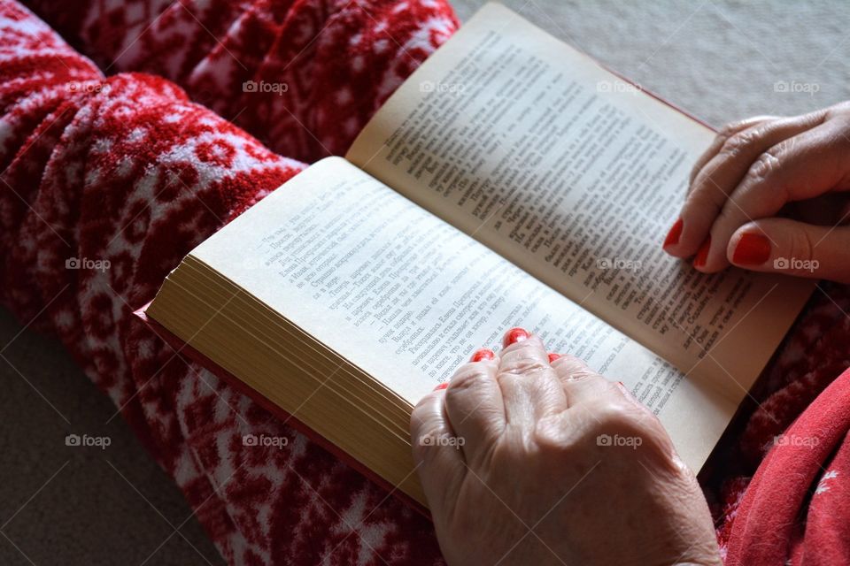 woman with book reading cozy winter time