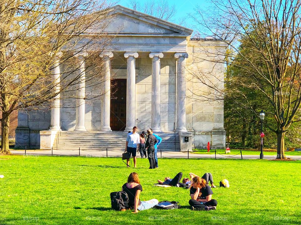 College students take in the afternoon sunshine on a beautiful summer day!