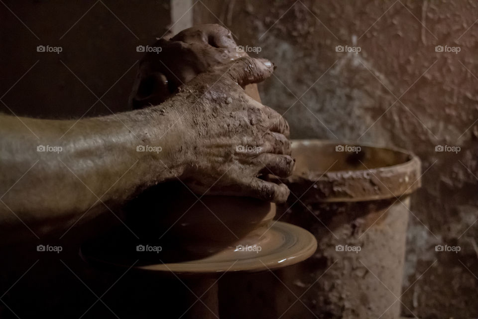 Man's Hand making pottery