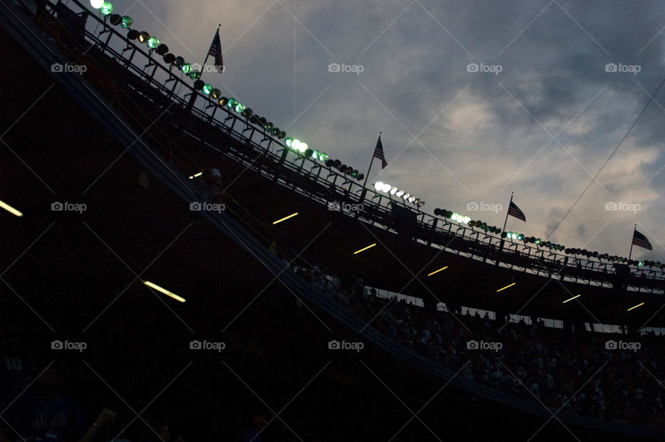 The lights over Shea stadium as the sun set after the final game before the stadium was torn down
