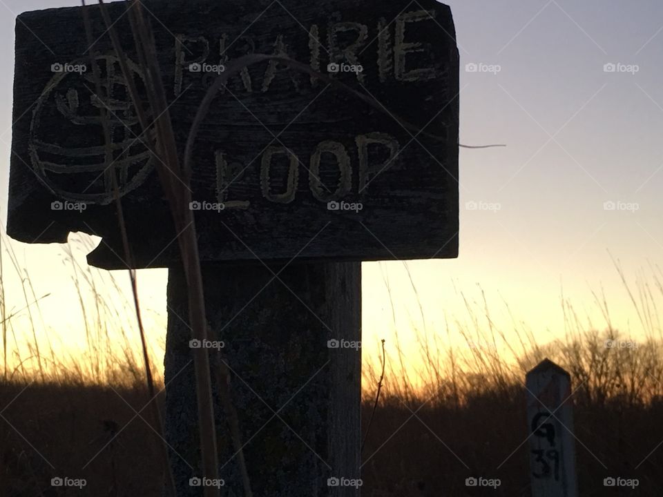 Trail marker at sunset.