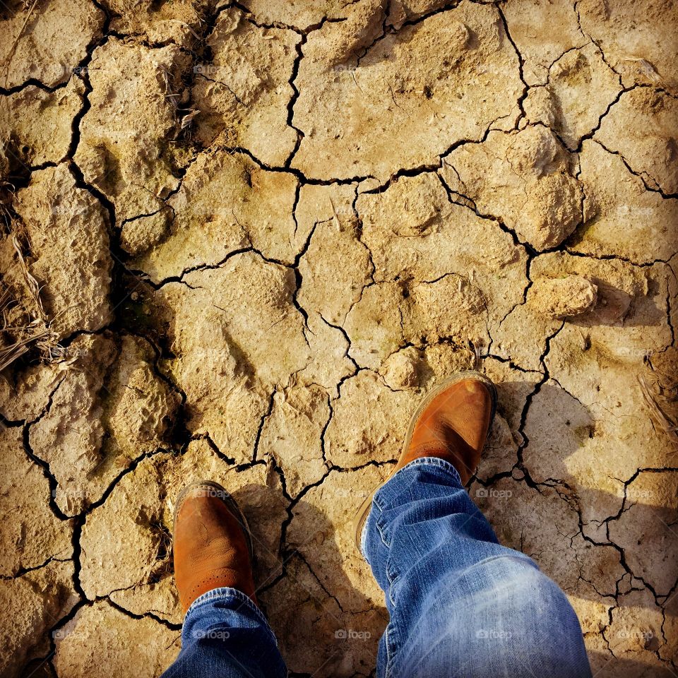 Drought. Parched farmland with selfie of my jeans and boots!