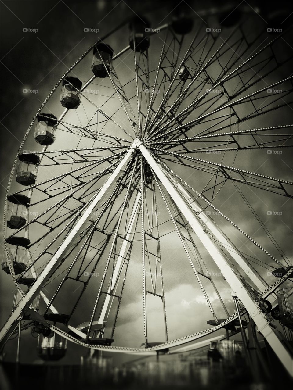 Low angle view of ferris wheel against sky