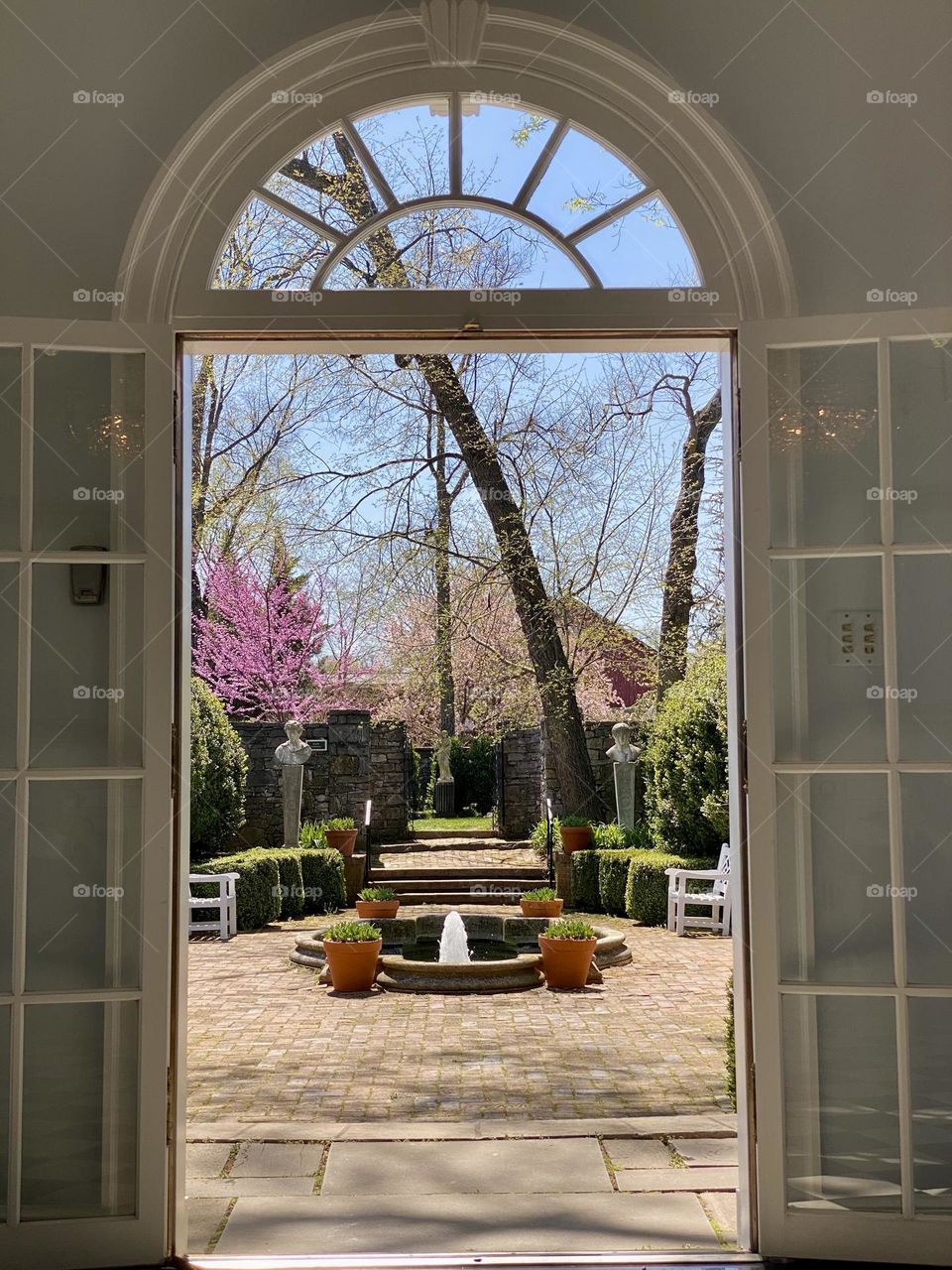 Looking through patio doors towards a courtyard garden