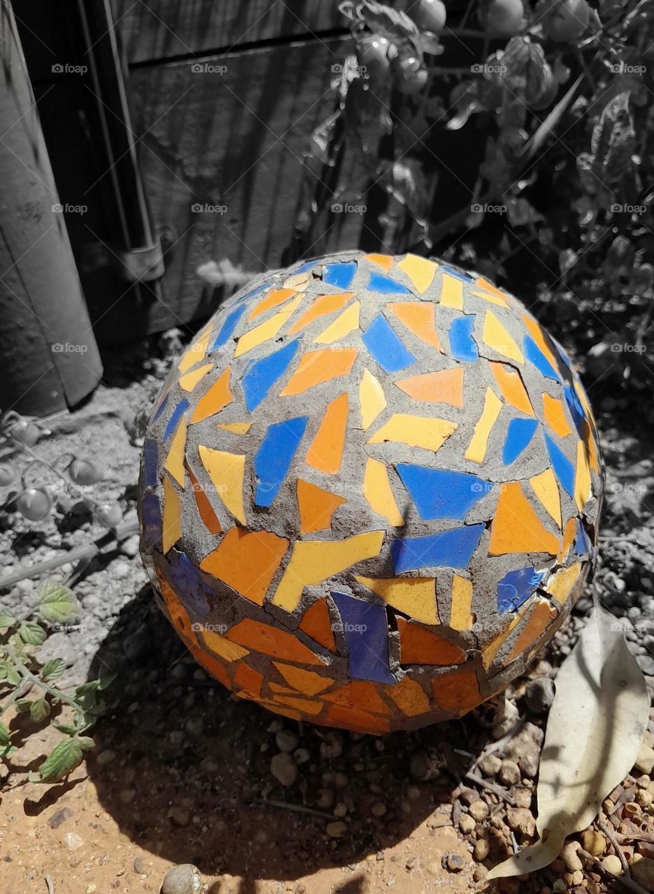 colours of summer, yet winter, all captured in a multicoloured, ancient garden ornament, found after years of being under the greenery, proving its colours can exist in harmony.