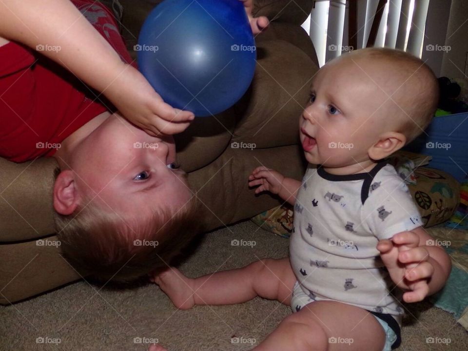 Balloon blowing boy